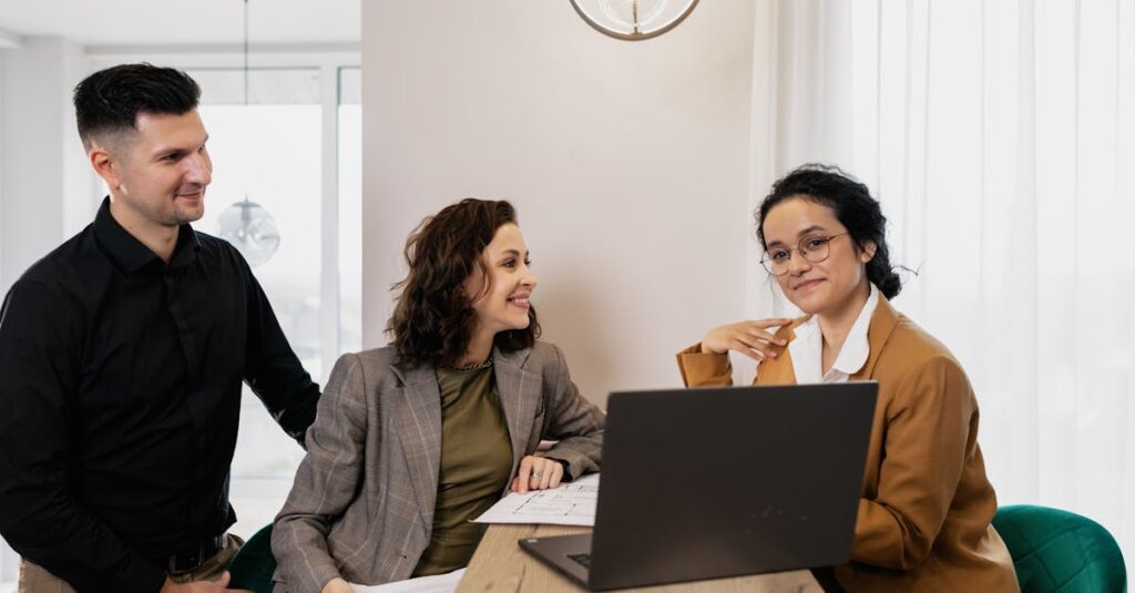 Professional business meeting with real estate consultant and couple in an office setting.